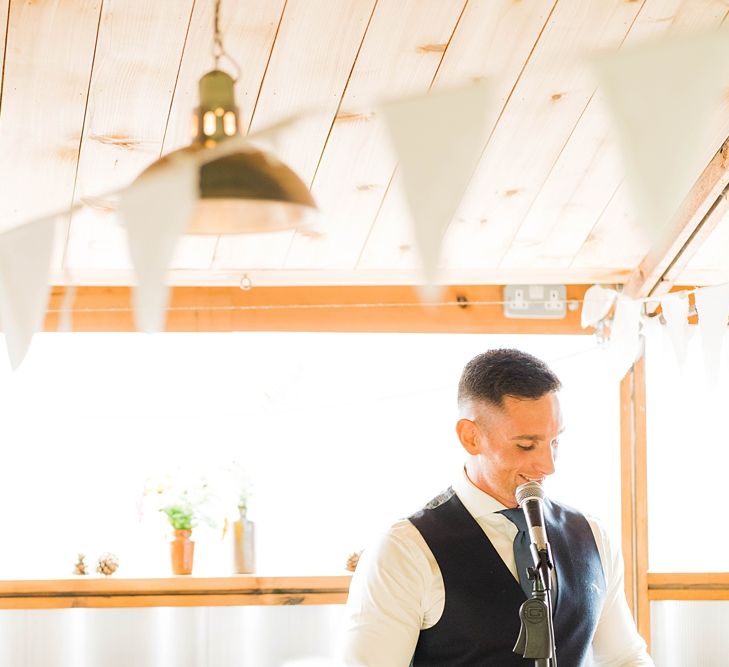 Groom's Speech | Groom in Blue T.M Lewin Suit with Navy Hawkes Bespoke Outfitters Waistcoat | Lace KatyaKatya Dress for Tipi Wedding at Fforest Farm | Claudia Rose Carter Photography