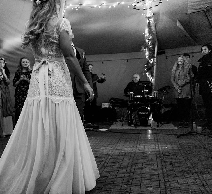 First Dance | Bride in Laced KatyaKatya Wedding Dress with Cap Sleeves and Ribbon Belt | Groom in Blue T.M Lewin Suit with Navy Hawkes Bespoke Outfitters Waistcoat | Lace KatyaKatya Dress for Tipi Wedding at Fforest Farm | Claudia Rose Carter Photography