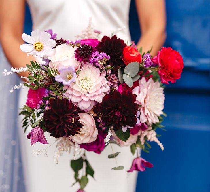 Beautiful vibrant bridal bouquet with pinks and purples