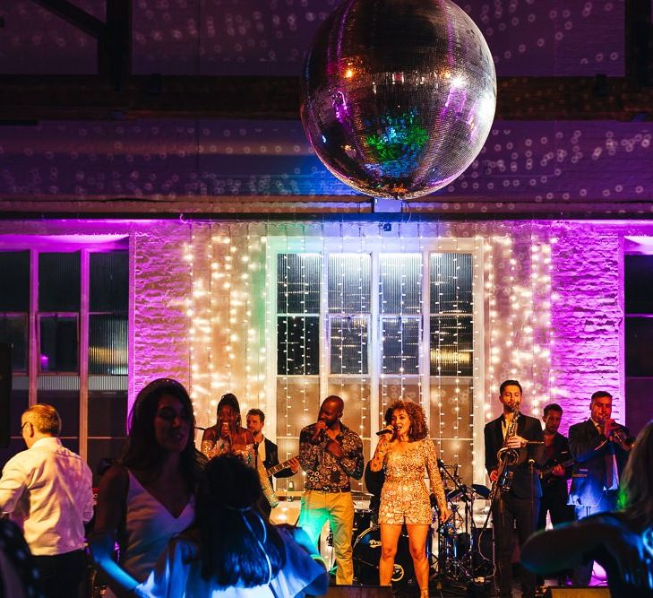 Entertainment at dry hire wedding venue with glitter ball