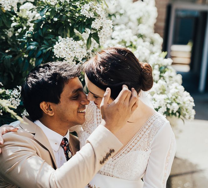 Bride sitting on her grooms knee