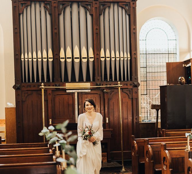 Bridal entrance in Rosa Clara wedding dress with long sleeves