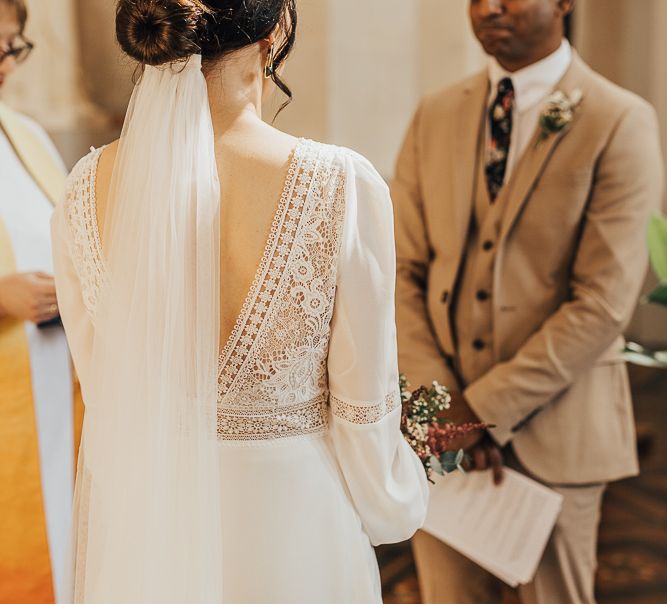 Lace V back detail and wedding veil on Rosa Clara dress