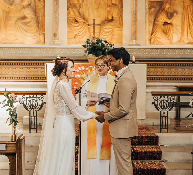 NHS Dr Annalan Navaratnam and Nurse Jann Tipping marry in the chapel of Guys and St Thomas Hospital in London amid Coronavirus pandemic by Rebecca Carpenter