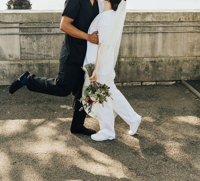 NHS Dr Annalan Navaratnam and Nurse Jann Tipping marry in the chapel of Guys and St Thomas Hospital in London amid Coronavirus pandemic by Rebecca Carpenter