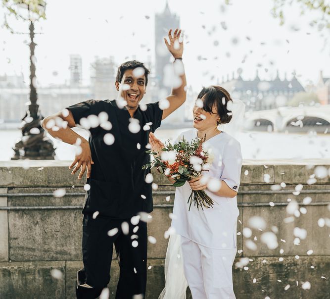 NHS Dr Annalan Navaratnam and Nurse Jann Tipping marry in the chapel of Guys and St Thomas Hospital in London amid Coronavirus pandemic by Rebecca Carpenter