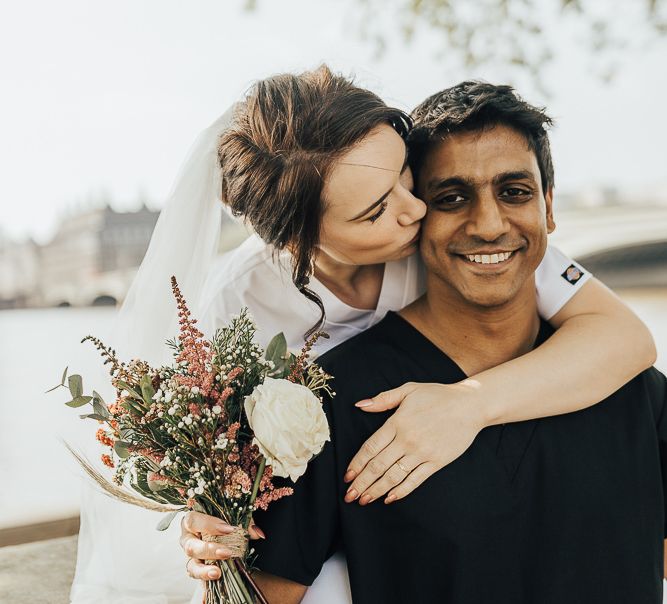 NHS Dr Annalan Navaratnam and Nurse Jann Tipping marry in the chapel of Guys and St Thomas Hospital in London amid Coronavirus pandemic by Rebecca Carpenter