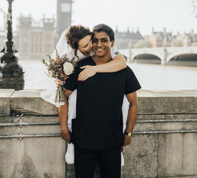 NHS Dr Annalan Navaratnam and Nurse Jann Tipping marry in the chapel of Guys and St Thomas Hospital in London amid Coronavirus pandemic by Rebecca Carpenter