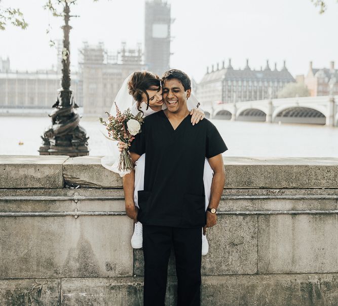 NHS Dr Annalan Navaratnam and Nurse Jann Tipping marry in the chapel of Guys and St Thomas Hospital in London amid Coronavirus pandemic by Rebecca Carpenter