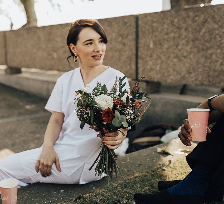 NHS Nurse in Scrubs Holding a Wedding Bouquet