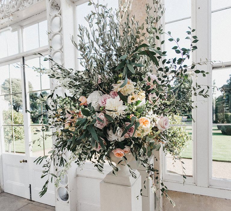 Wedding Reception Decor at Syon Park | Huge Urn of Cafe au Lait Dahlias, David Austin Roses, Hydrangeas, Delphinium, Cosmos, Eucalyptus and Olive | Stunning Syon Park Wedding with Quill Stationery Suite | Nancy Ebert Photography