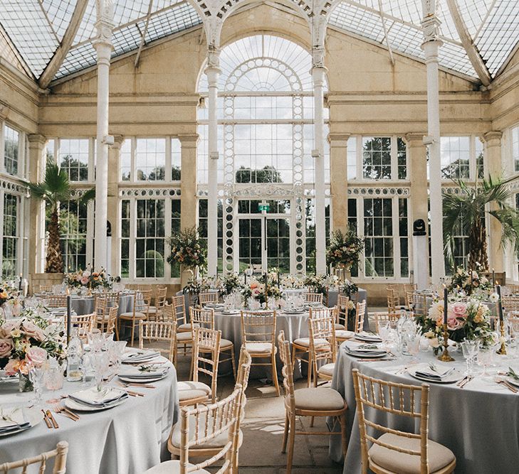 Wedding Reception Decor | Blush, Cream and Pink Floral Centrepieces | Grey Tablecloths | Grey Tapered Candles | Gold Cutlery | Pink Goblets | Stunning Syon Park Wedding with Quill Stationery Suite | Nancy Ebert Photography