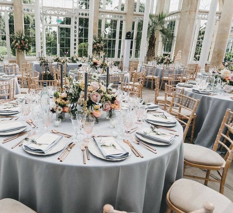 Wedding Reception Decor | Blush, Cream and Pink Floral Centrepieces | Grey Tablecloths | Grey Tapered Candles | Gold Cutlery | Pink Goblets | Stunning Syon Park Wedding with Quill Stationery Suite | Nancy Ebert Photography