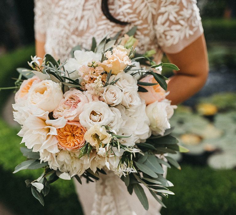 Blush, Cream and Pink Bridal Bouquet | Cafe au Lait Dahlias, David Austin Roses, Hydrangeas, Delphinium, Cosmos, Eucalyptus and Olive | Bride in Hermione de Paula Wedding Gown with Short Sleeves and Personalised Embroidery | Stunning Syon Park Wedding with Quill Stationery Suite | Nancy Ebert Photography