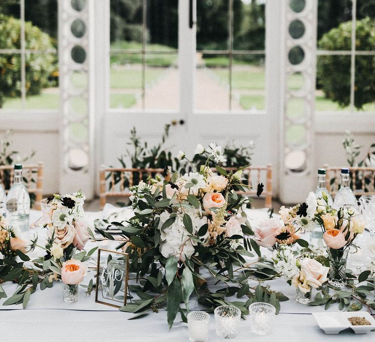 Wedding Reception Decor | Top Table | Blush, Cream and Pink Floral Centrepieces | Grey Tablecloth |  Gold Table Number | Stunning Syon Park Wedding with Quill Stationery Suite | Nancy Ebert Photography