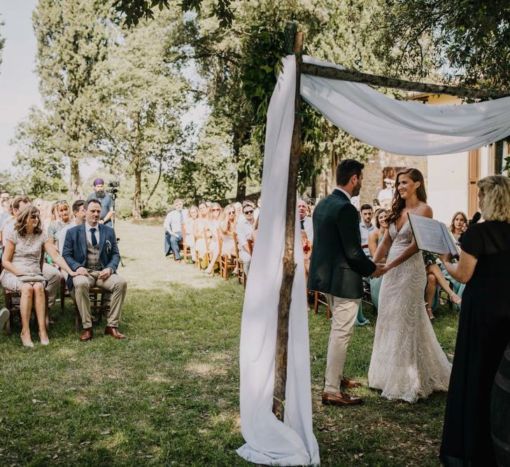 Bride and groom during outdoor wedding ceremony