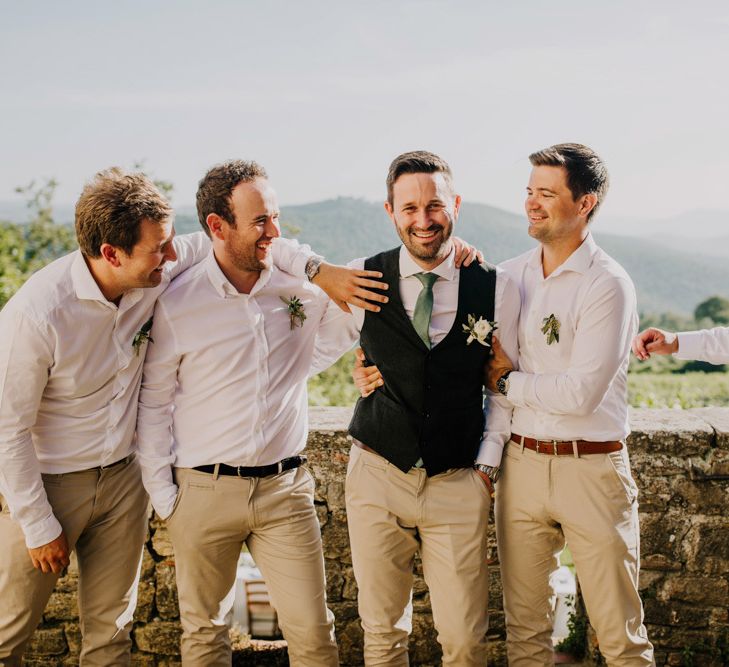 Groom with groomsmen in matching cream chinos