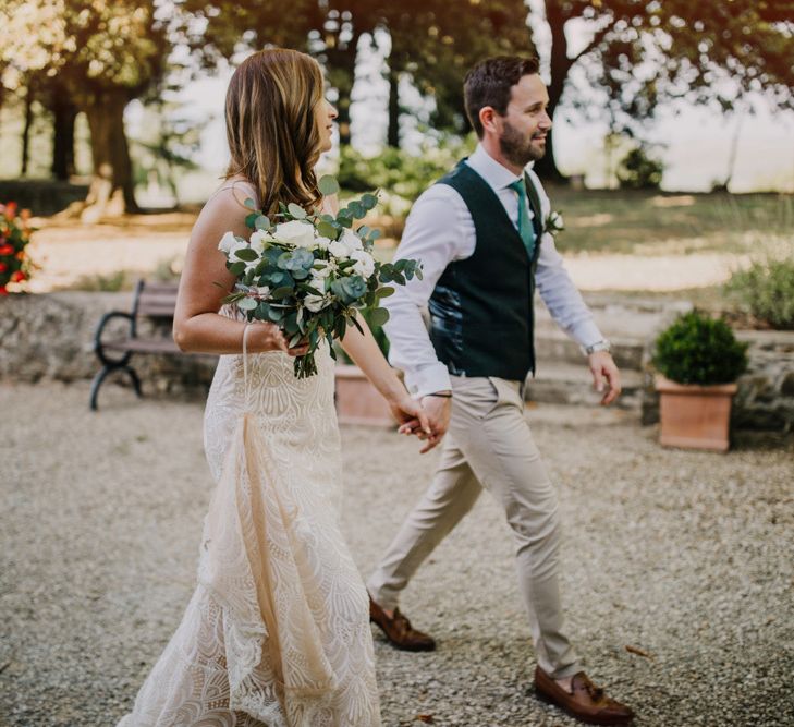 Bride carried foliage bouquet with white flowers