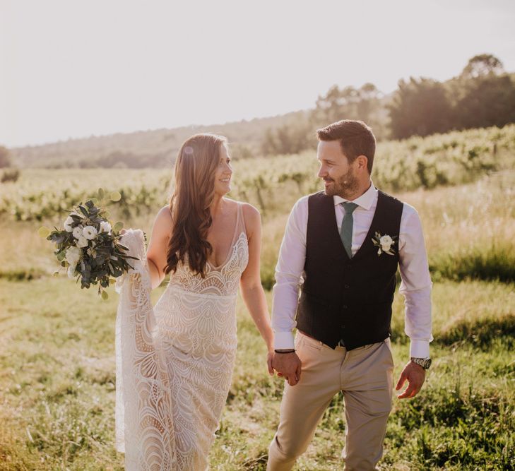 Bride and groom at Italian wedding with bridesmaid dresses in mint green