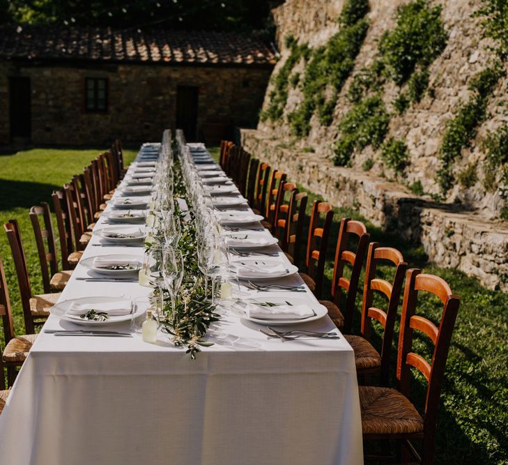 Wedding table decor using foliage and greenery with bridesmaid dresses in mint green