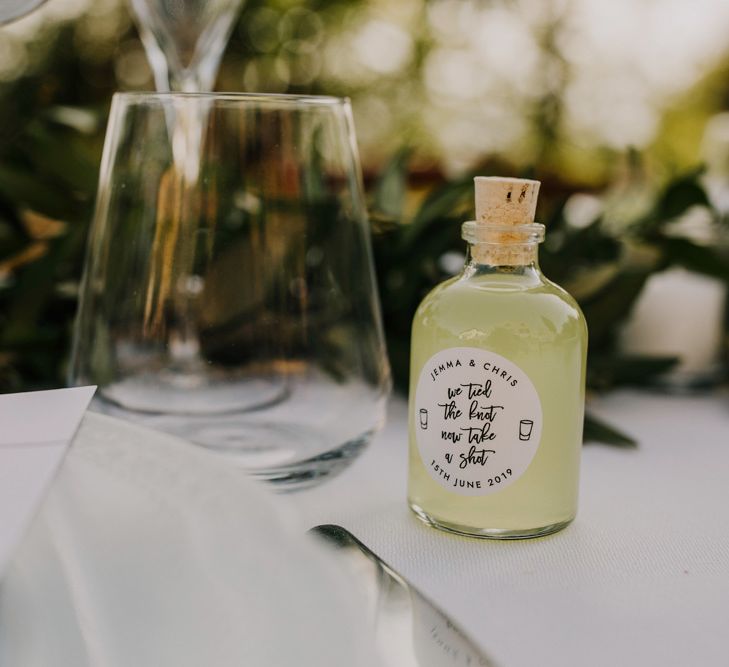 Limoncello wedding favours at wedding with bridesmaid dresses in mint green