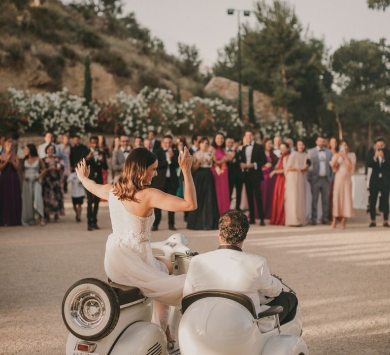 Bride and Groom Riding in a Vespa and Side Car