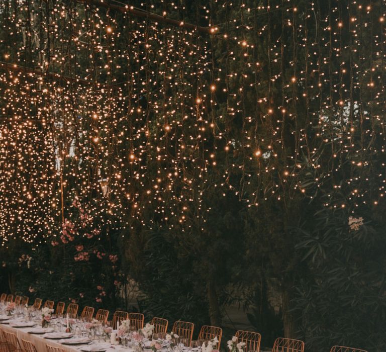 Outdoor Wedding Reception with Fairy Lights Canopy &amp; Rose Gold Wire Chairs