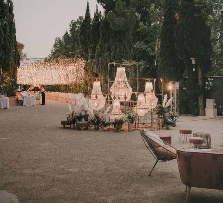 Outdoor Reception with Fairy Lights Canopy and Chandelier Table Plan