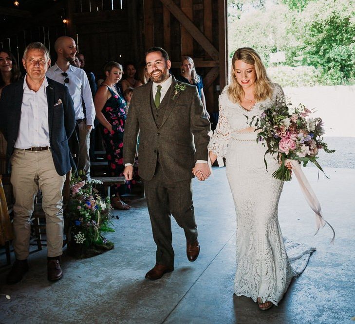 Bride and Groom Walk Up The Aisle Together