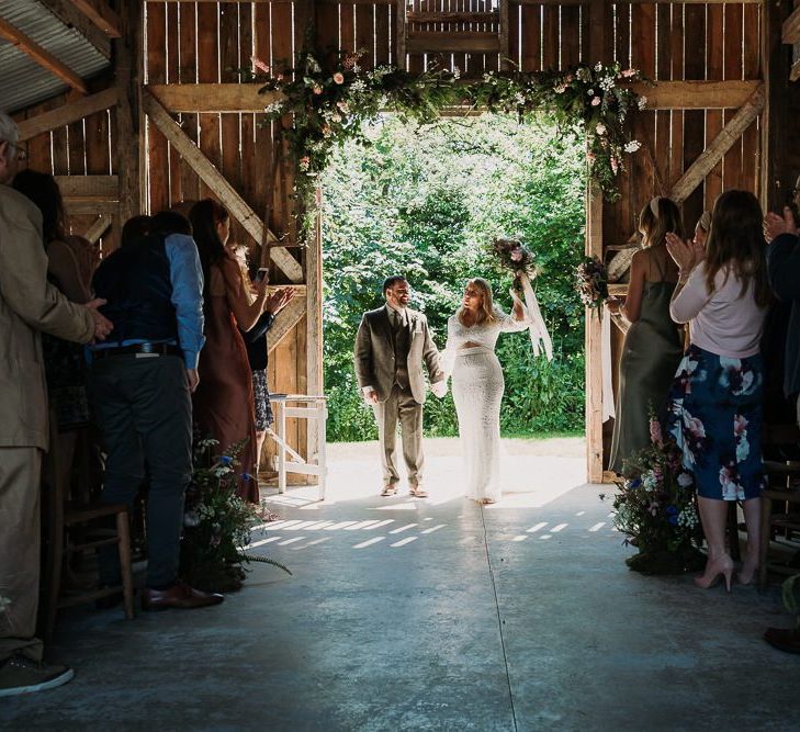 Bride and Groom During Rustic Barn Ceremony