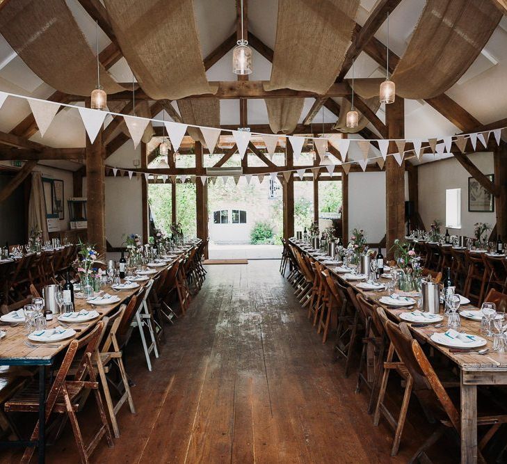 Rustic Barn Wedding Table Set Up With Bunting