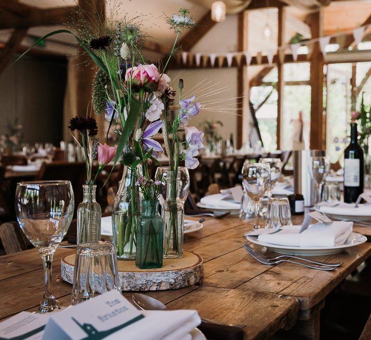 Rustic Barn Wedding Table Set Up With Wild Flowers