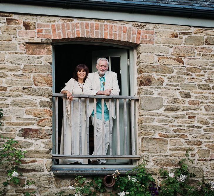 Wedding Guests Look Out of Barn During Wedding