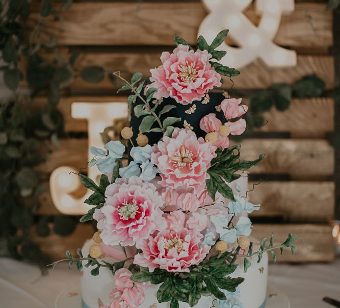 Pastel wedding flowers to match embroidered veil