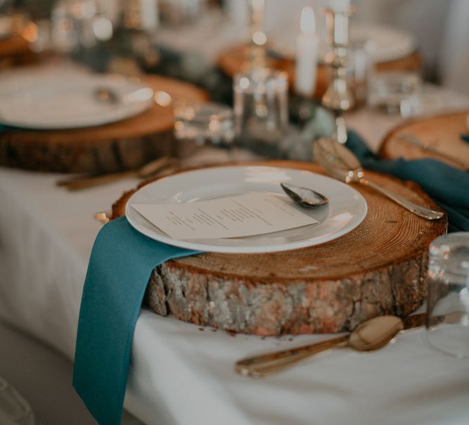 Rustic wedding table decor with tree slices