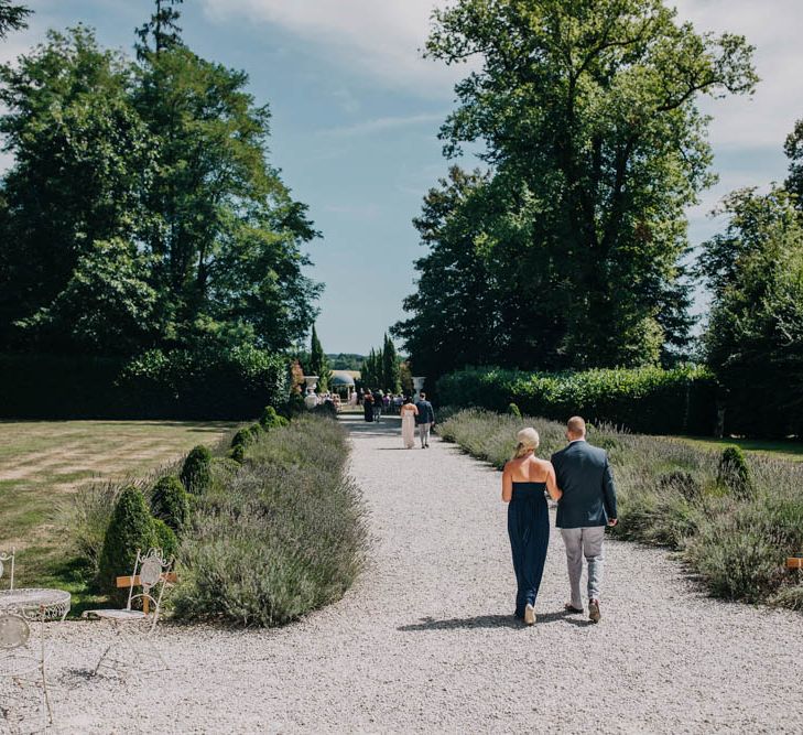 Bridesmaids in Strapless Navy or Pink Dresses from ASOS | Groomsmen in Navy Jackets and Grey Trousers | Arrival of the Bridal Party at Chateau La Durantie, Dordogne | Outdoor Seating Area and Macaroon Tower at French Chateau Wedding | Lush Imaging