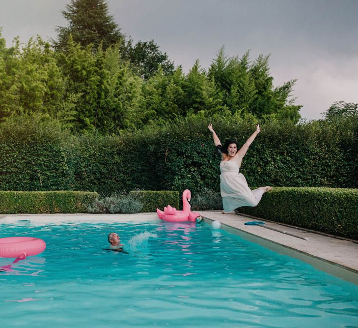 Swimming Pool at Chateau La Durantie, Dordogne | Bridesmaid in Strapless Pink Dress from ASOS | Outdoor Seating Area and Macaroon Tower at French Chateau Wedding | Lush Imaging