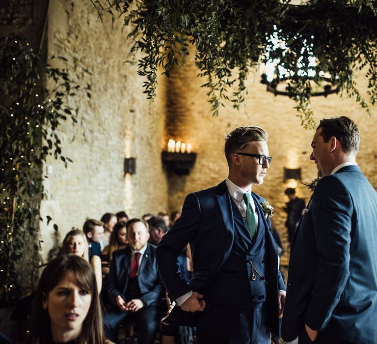 Groom and Best Man at the Altar in Navy Suits with Forest Green Ties