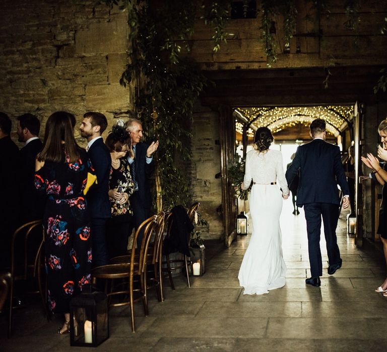 Bride and Groom Exiting Their Stone Barn Wedding Ceremony