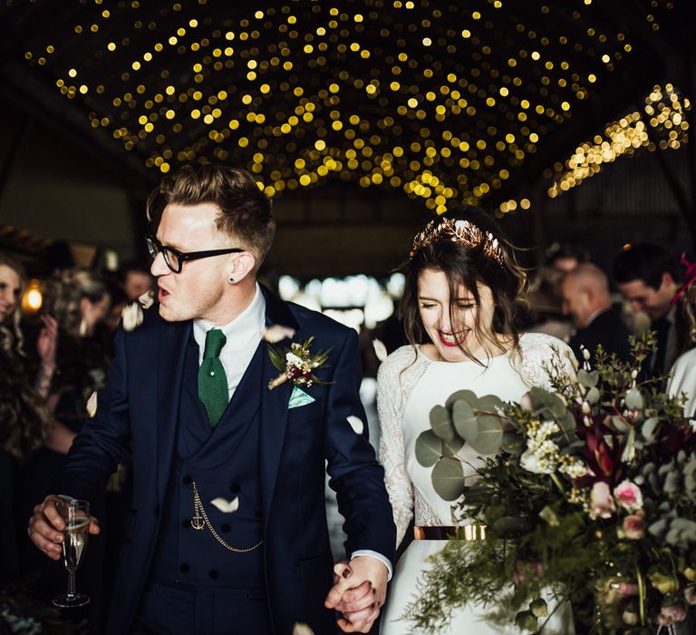 Stylish Bride and Groom Confetti Exit Under Stone Barn Wedding Wedding Venue Fairy Lights