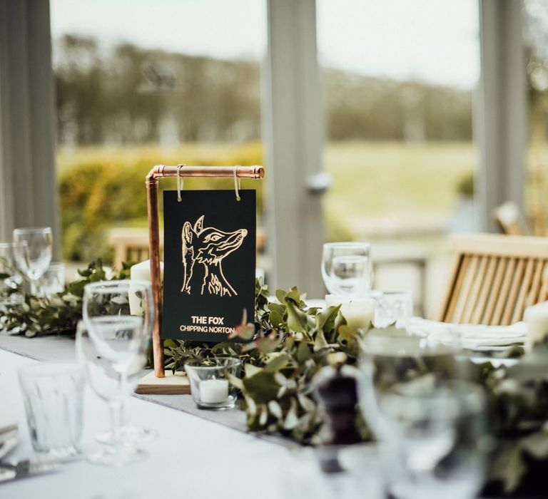 Black &amp; White Table Name Sign Hanging From Copper Frame