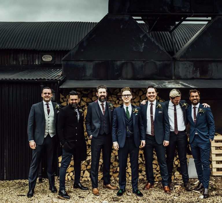 Groomsmen in navy Blue suits with Green and Burgundy Ties