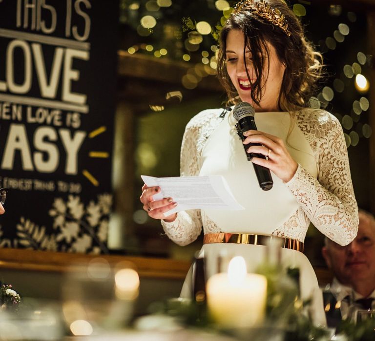 Bride in Wedding Dress with Lace Long Sleeves Giving Her Wedding Speech