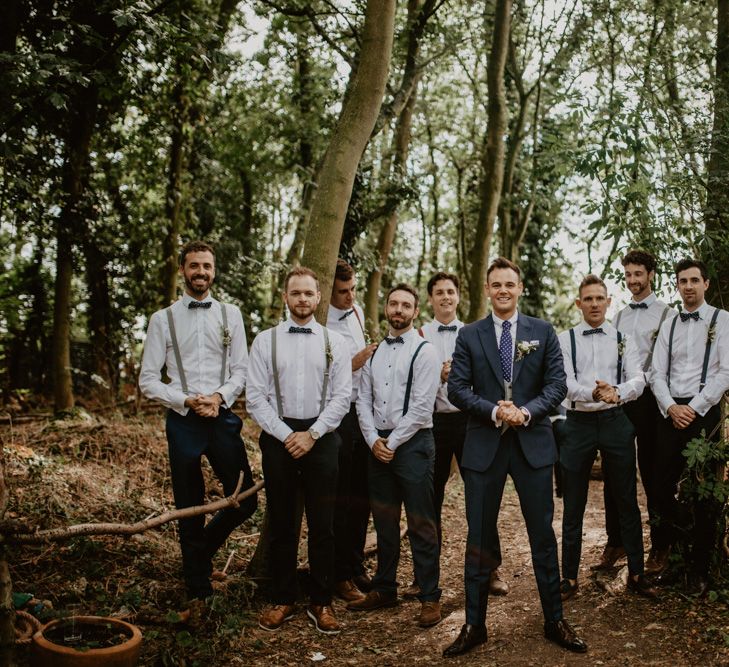 Groomsmen in Bow Tie &amp; Braces | Groom in Navy Blue Suit  | Macramé &amp; Dreamcatcher Woodland Wedding at Upthorpe Wood | Camilla Andrea Photography