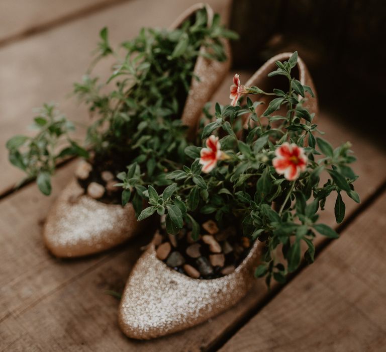 Flower Filled Glitter Shoes | Wedding Decor | Macramé &amp; Dreamcatcher Woodland Wedding at Upthorpe Wood | Boho Bride in Flower Crown &amp; Kula Tsurdui  Wedding Dress | Groom in Navy Blue Suit  | Camilla Andrea Photography