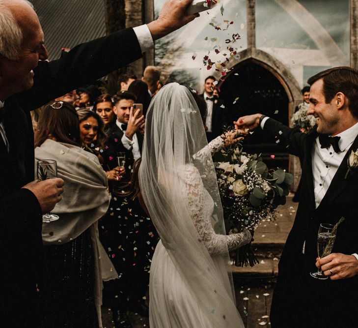 Confetti Moment with Bride in Made With Love Bridal Wedding Dress and Groom in Tuxedo