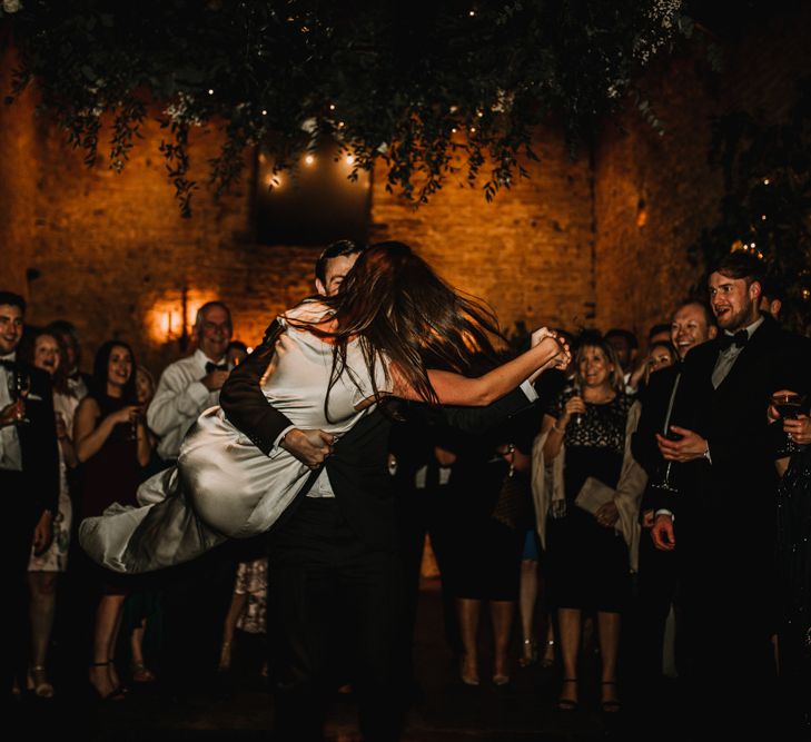 First Dance with Groom Twirling His Bride Around