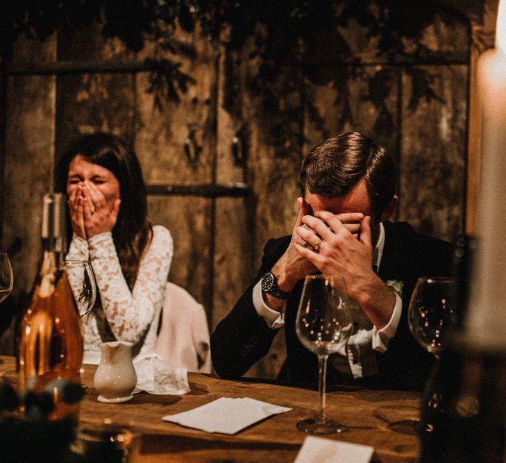 Groom Covering his Face During Wedding Reception Speeches