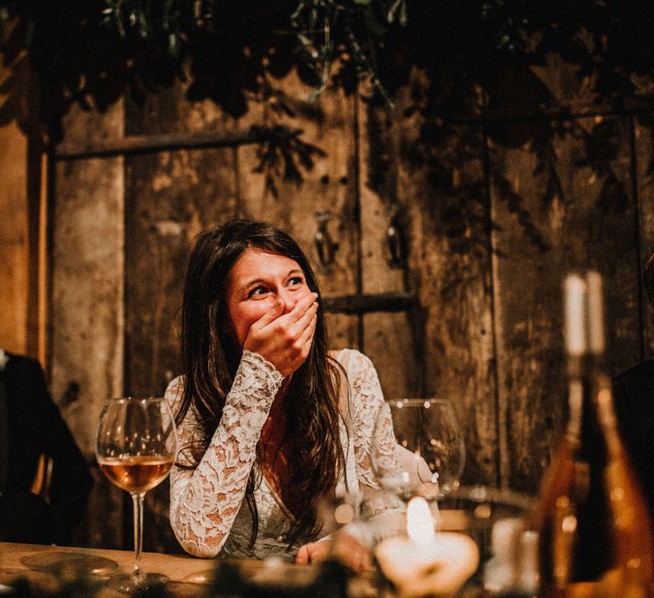 Bride in Made With Love Wedding Dress Covering Her mouth in Shock During Wedding Speeches