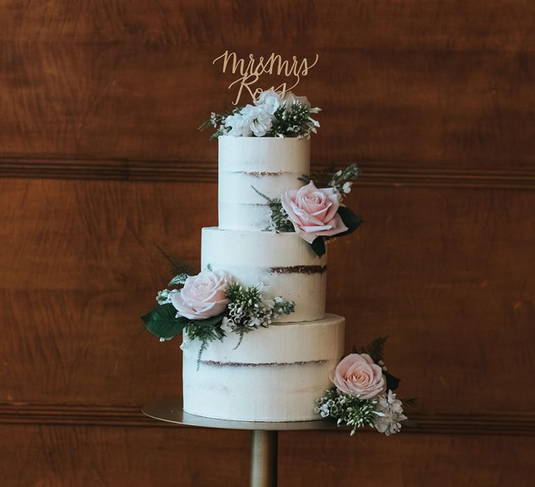 Three-Tier Semi-Naked Wedding Cake on Gold Stand with Fresh Flowers | Gold Calligraphy Cake Topper | Statement Floral Arrangement Altar and Potted Plants with Copper Frame Table Plan and Lace Jacket | Miss Gen Photography